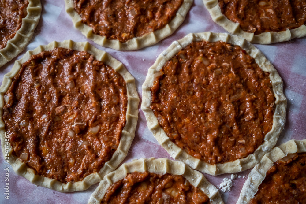 Top view of homemade pide, turkish flatbread with ground meat, mini pita breads or mini turkish pizzas Top view of homemade pide, turkish flatbread with ground meat, mini pita breads or mini turkish pizzas