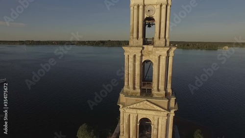KALYAZIN, RUSSIA-15/08/2019: Fly over the water near the flooded bell tower in the middle of the Volga river in the city of Kalyazin