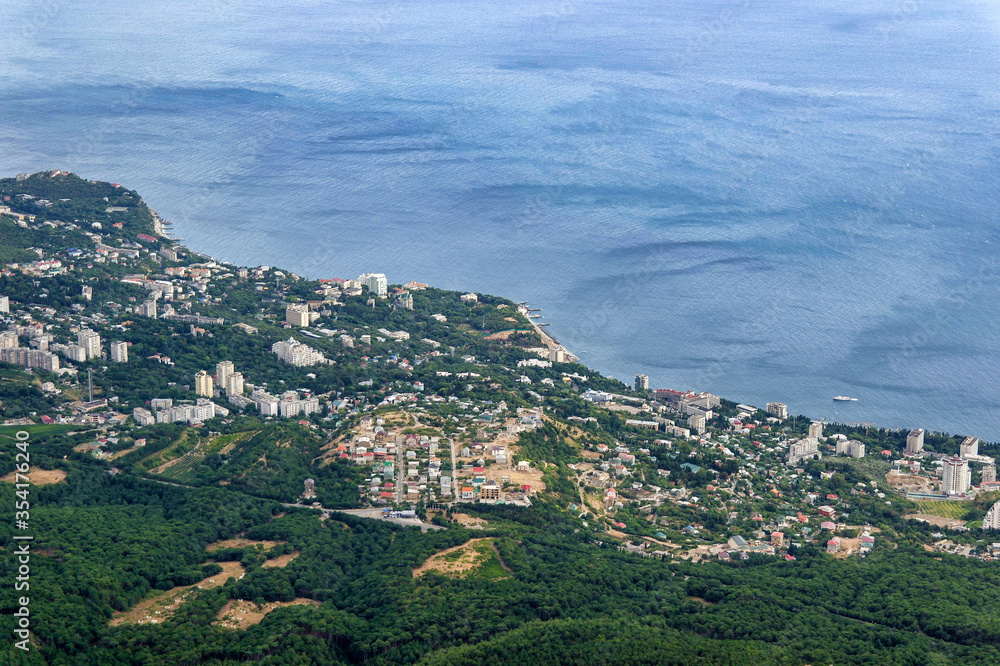 Summer aerial view on the city by the sea coast