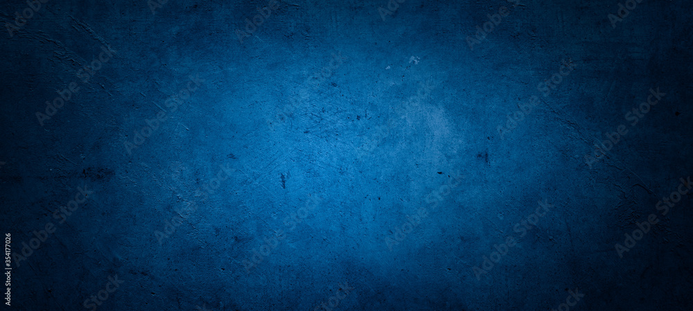 Fototapeta premium Blue textured concrete wall background. Dark edges