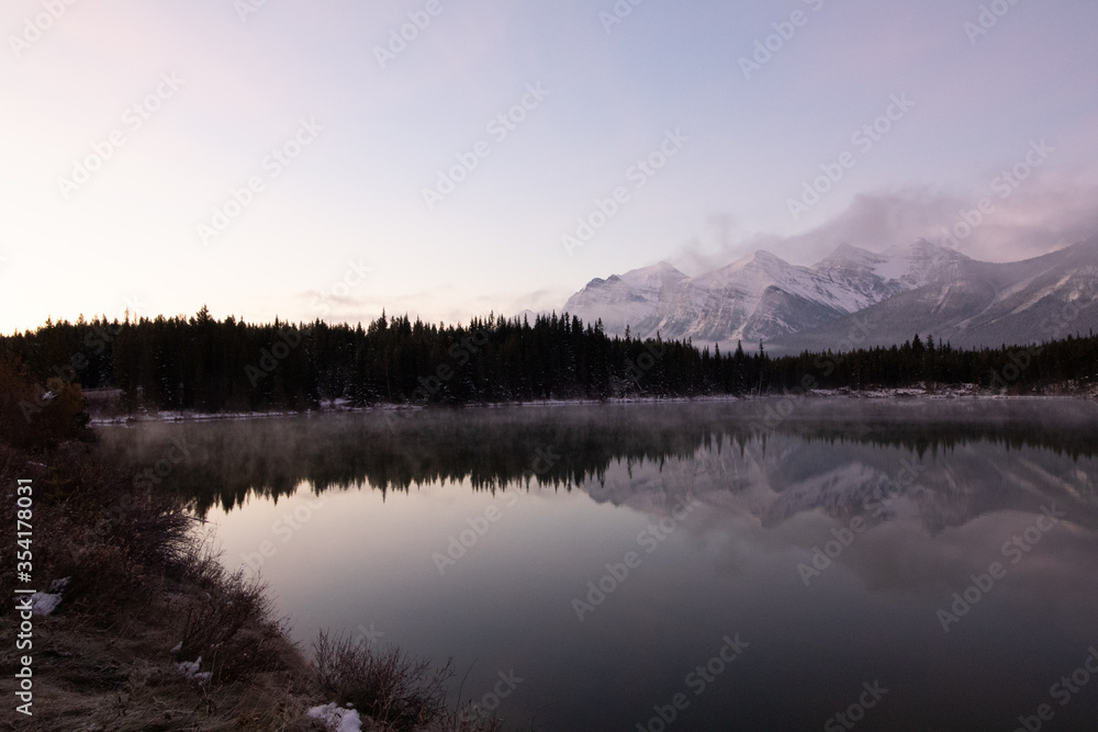 Fototapeta premium Misty Mountain Reflected Off the Glassy Lake