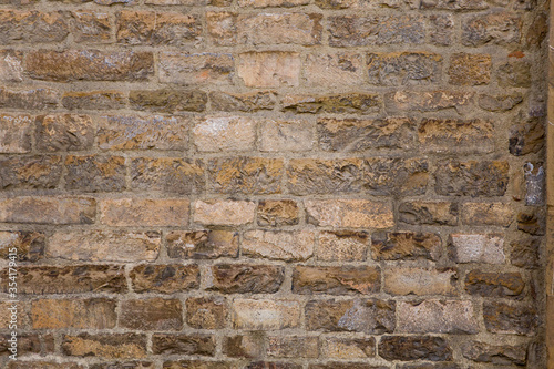 Brick wall of an old building. Masonry or brickwork of antique construct. Texture, background.