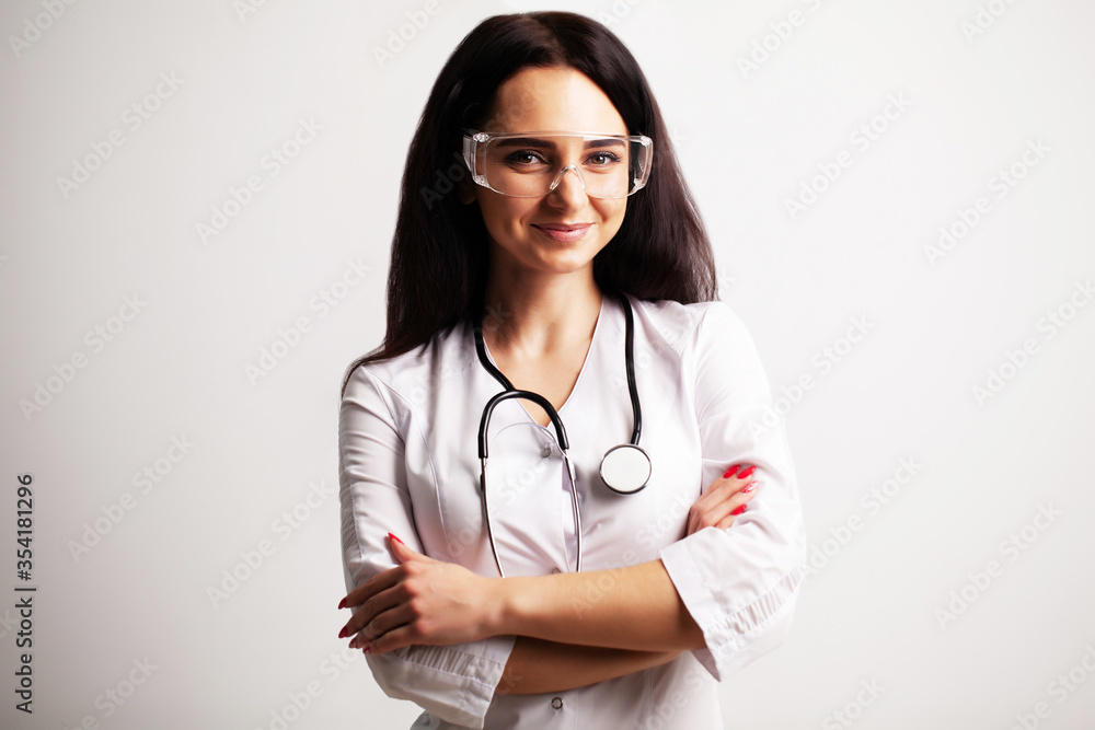 Portrait of a doctor with glasses and a white medical gown looking at the camera Portrait of a doctor with glasses and a white medical gown looking at the camera