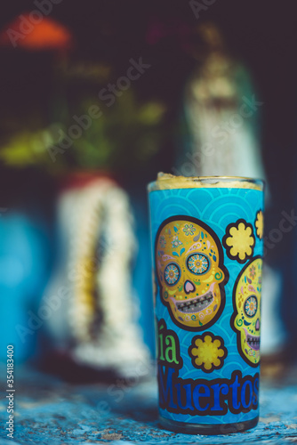 Cozumel , Caribbean / Mexico - May 2017
Cemeteries in Mexico are colorful as expressions of the culture, Mexican families come to visit the souls of the departed. photo