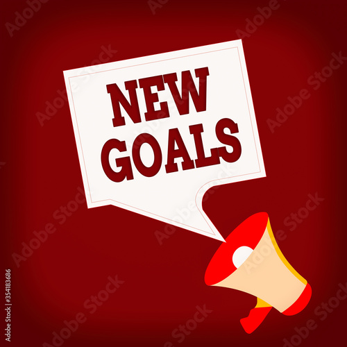 Conceptual hand writing showing New Goals. Concept meaning a list of clearlydefined plans that an individual should attain Megaphone and Blank Square Speech Bubble Public Announcement photo