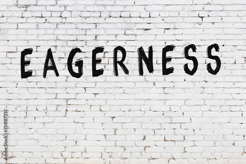 Photos Word eagerness painted on white brick wall
