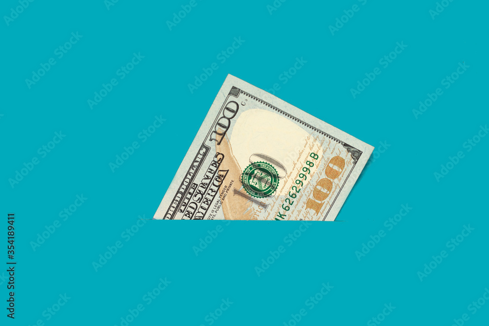 One hundred dollar bill in your pocket. Money close up. Abstraction