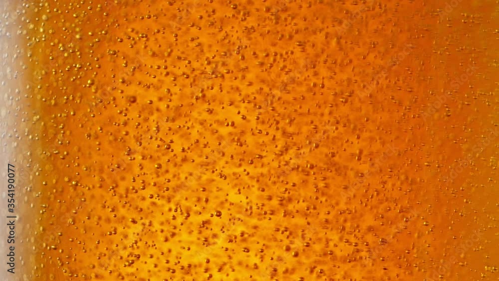 Super Slow Motion Detail Shot of Beer Bubbles in Glass at 1000fps. Super Slow Motion Detail Shot of Beer Bubbles in Glass at 1000fps.