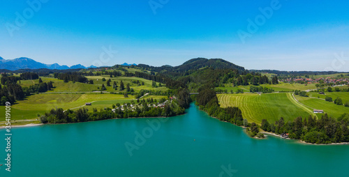 Aerial view over Lake Forggensee at the city of Fuessen in Bavaria Germany