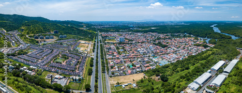 Aerial drone view of gated communities outside Guayaquil City, Ecuador and the main highway going to Via a la Costa. Shot from over houses and homes.