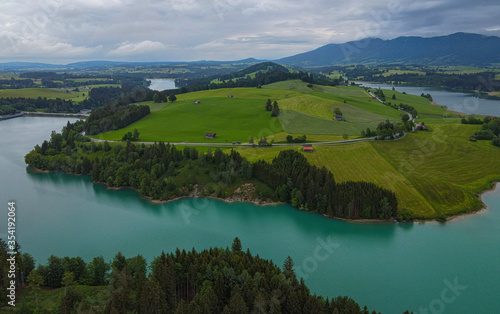 Aerial view over Lake Forggensee at the city of Fuessen in Bavaria Germany