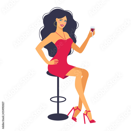 Sitting woman in bar with glass in hand.