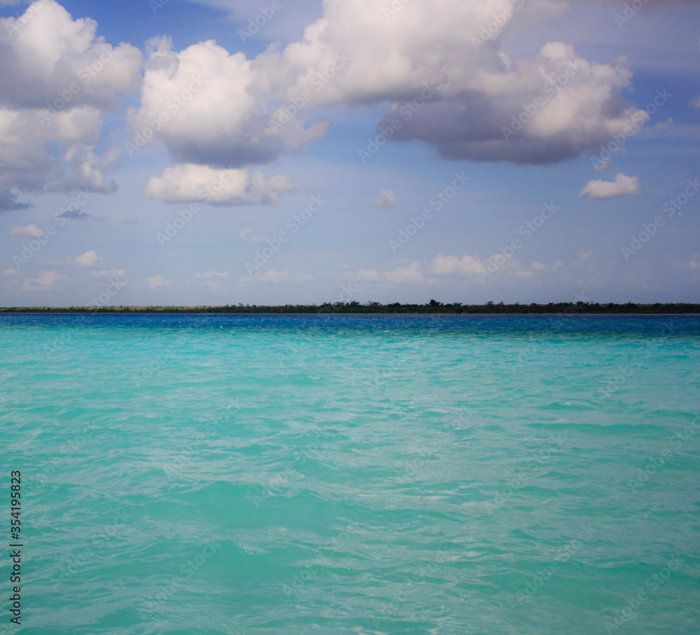 The Bacalar lake is renowned for its striking blue color shades and water clarity The Bacalar lake is renowned for its striking blue color shades and water clarity