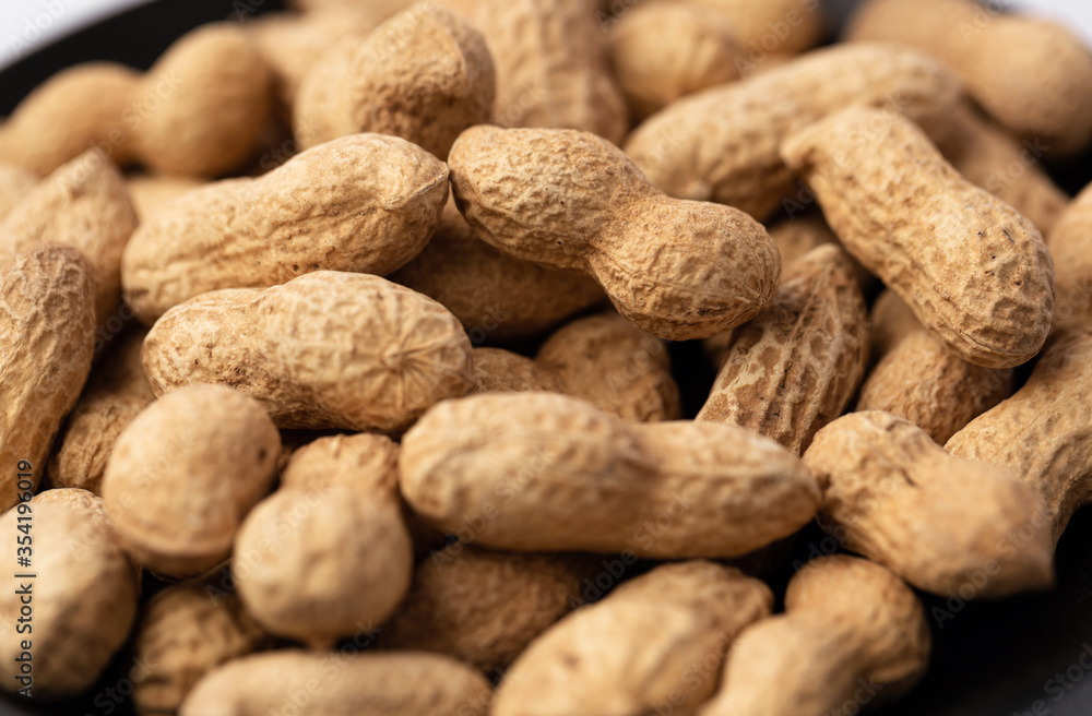 peanut in a shell texture on white background.