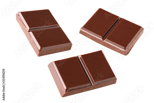 Three dark chocolate pieces set on a white background .Clipping path