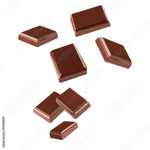 Three dark chocolate pieces  on a white background .Clipping path