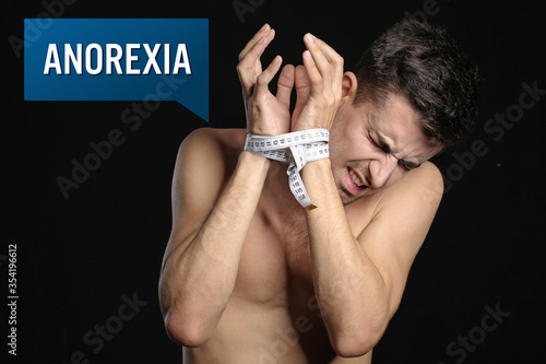 Skinny man with measuring t...