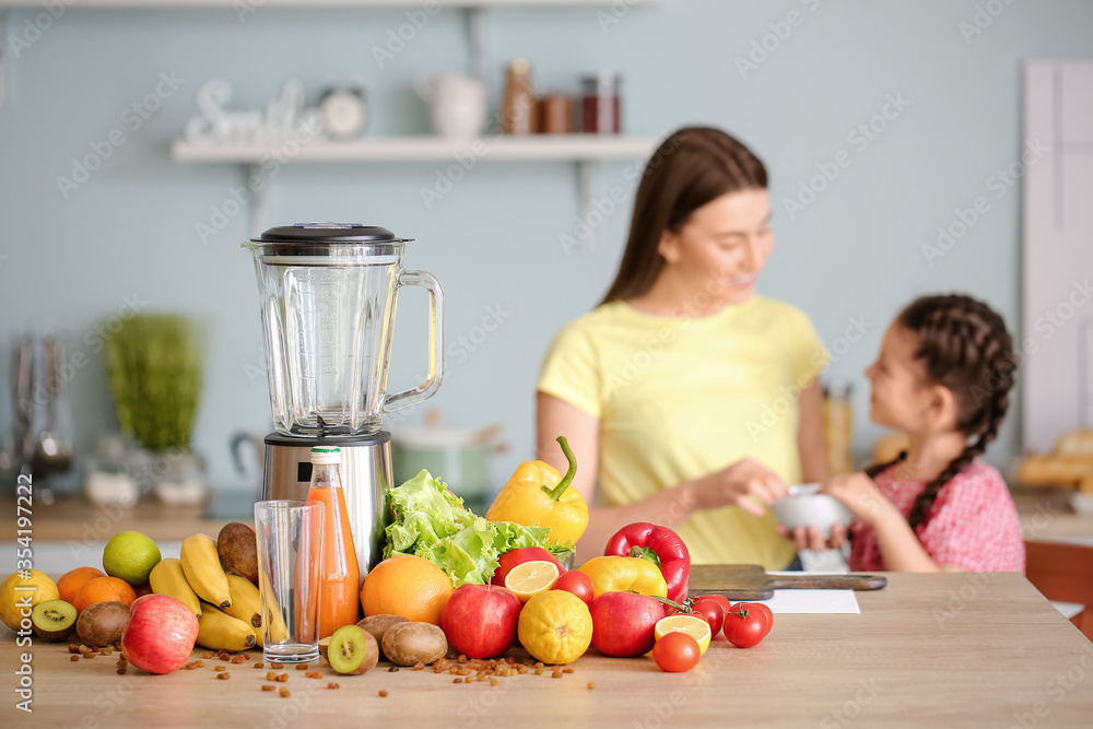 Blender and ingredients for smoothie on kitchen table
