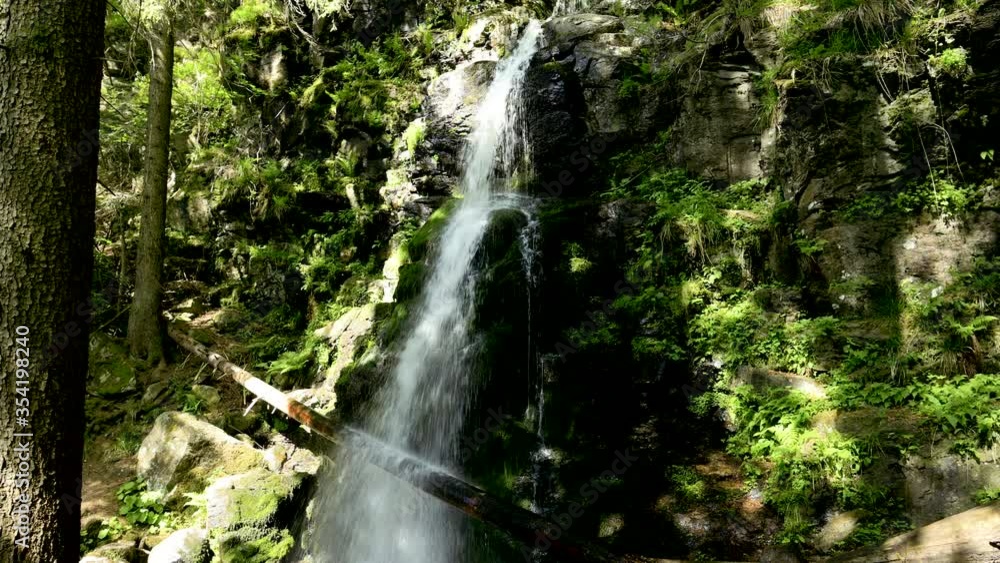 Beautiful shot of a small waterfall in the black forest Beautiful shot of a small waterfall in the black forest