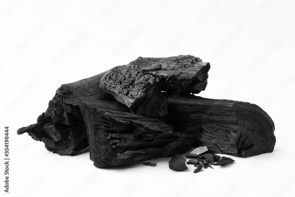 Natural wood charcoal on white background