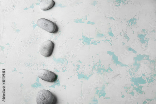 Smooth gray spa stones in a...