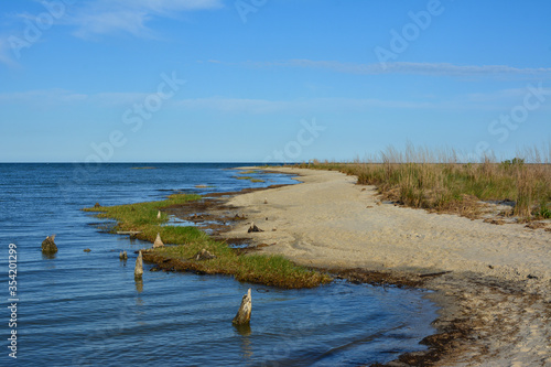 Wide open beach along the Chesapeake Bay at Hughlett Point Natural Area at the tip of the Northern Neck in Virginia. 