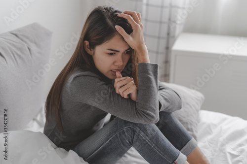 asian young teenager sit on bed feel depressed mental health problem