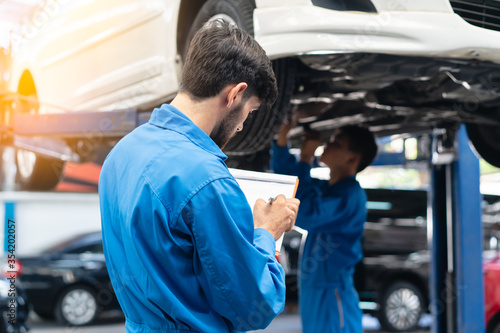 Auto check up car service mechanic checklist repair engine. photo