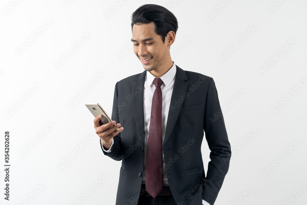 young asian businessman smile hold phone formal suit white background. young asian businessman smile hold phone formal suit white background.