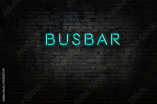 Neon sign with inscription busbar against brick wall