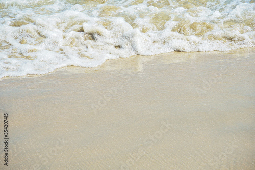 wave on sand, ocean wave on sandy beach in summer with copy space for text, Background.