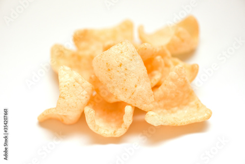 prawn crackers chips isolated on white background - homemade crunchy prawn crackers or shrimp crisp rice traditional snack