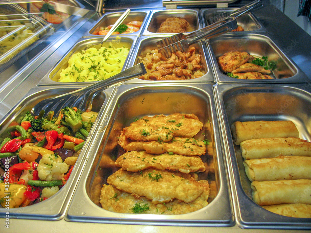 Trays with food in a Russian cuisine canteen