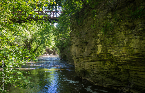 Bridge Over a River Surrounded by Limestone Walls