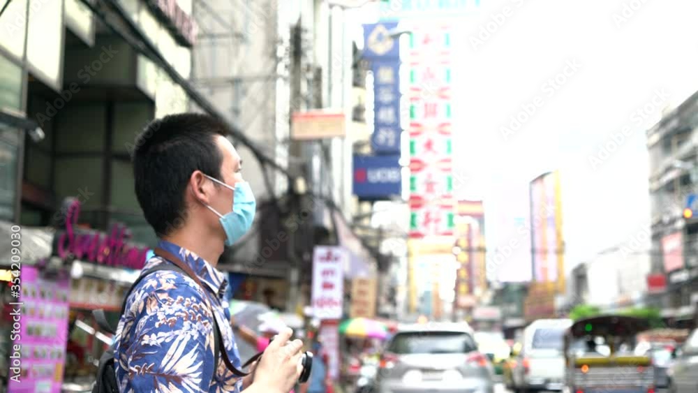 Tourists taking photo of Yaowarat Road in Thailand Tourists taking photo of Yaowarat Road in Thailand
