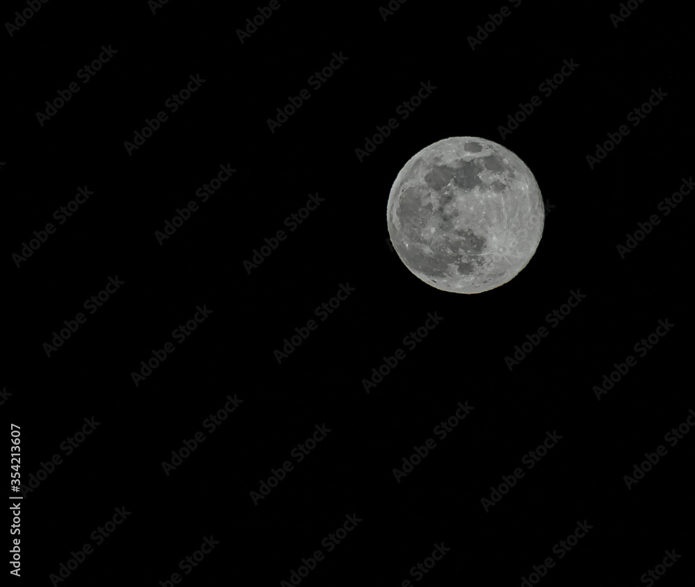 Full moon during supermoon with a black night sky background in San Francisco, California, United States Full moon during supermoon with a black night sky background in San Francisco, California, United States