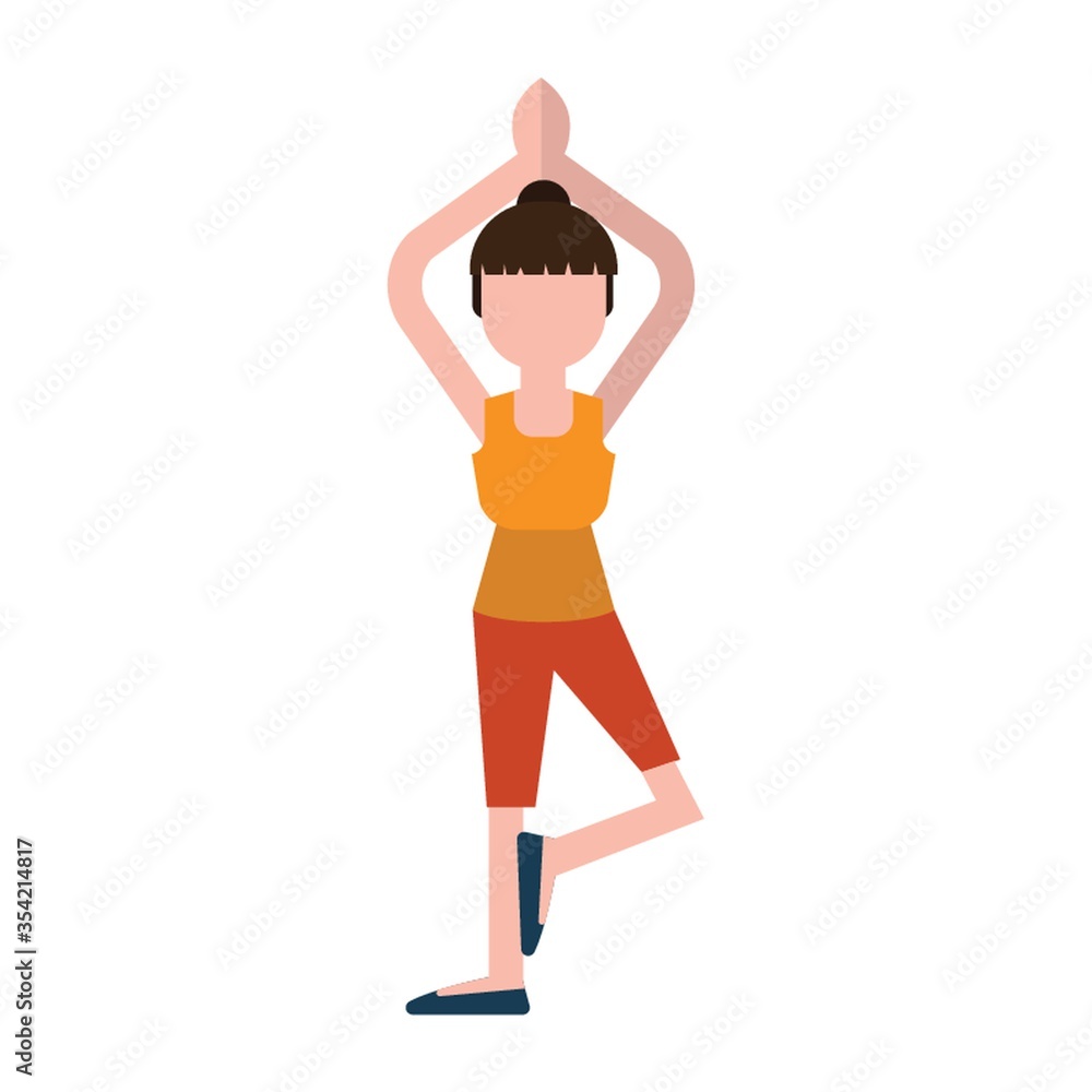 Woman practicing yoga in tree pose Woman practicing yoga in tree pose