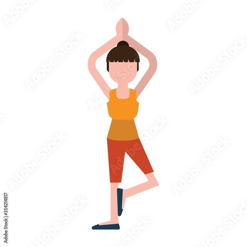 Woman practicing yoga in tree pose