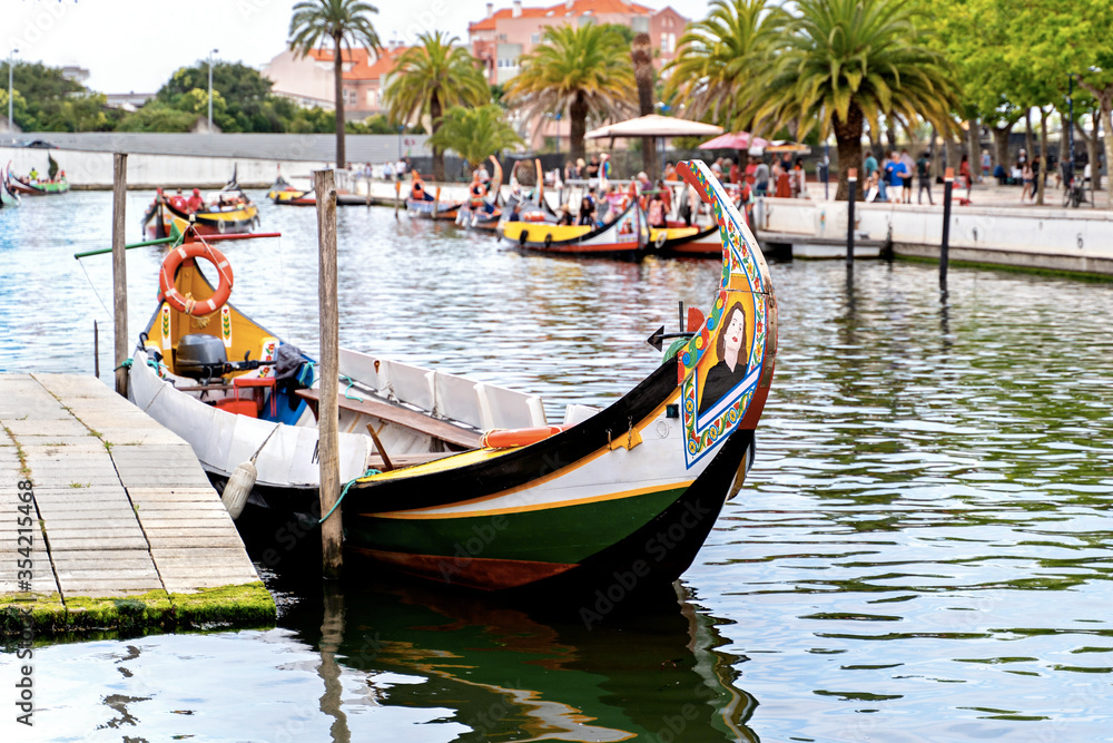 Moliceiro boats docked along the central canal in Aveiro, called Portugal Venice