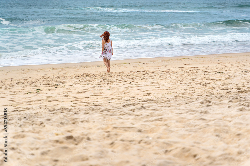 Relaxed woman enjoying ocean, freedom and life at beach. Young lady feeling free, relaxed and happy. Concept of freedom, happiness, enjoyment and well being. Relaxed woman enjoying ocean, freedom and life at beach. Young lady feeling free, relaxed and happy. Concept of freedom, happiness, enjoyment and well being.