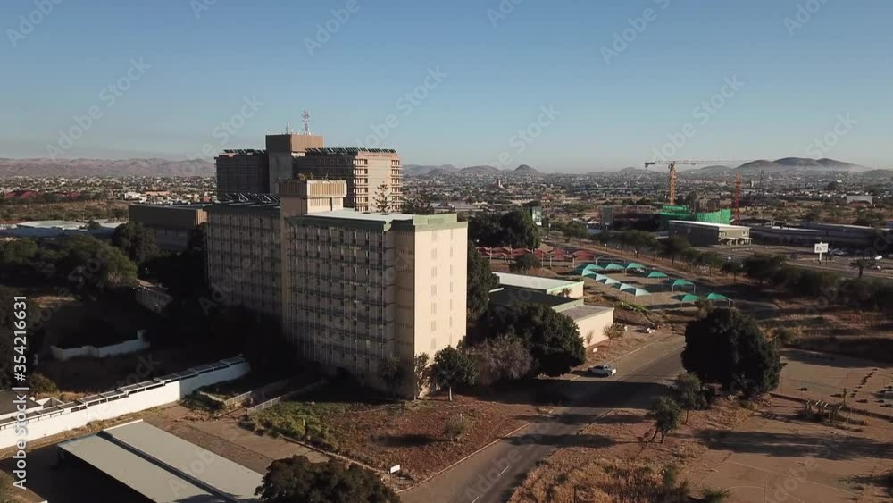 4K aerial drone summer sunny day video of Windhoek Katutura suburb large state hospital near B1 main highway in Namibia's capital in central highland Khomas Hochland of Namibia, southern Africa 4K aerial drone summer sunny day video of Windhoek Katutura suburb large state hospital near B1 main highway in Namibia's capital in central highland Khomas Hochland of Namibia, southern Africa