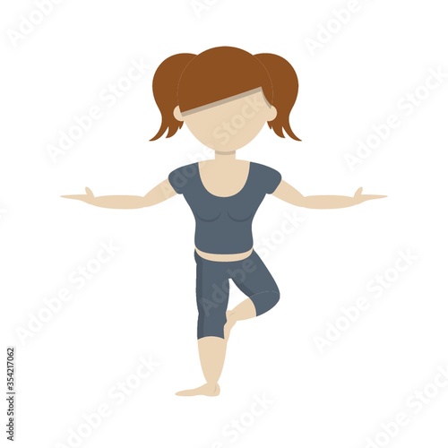 Girl practicing yoga in tree pose