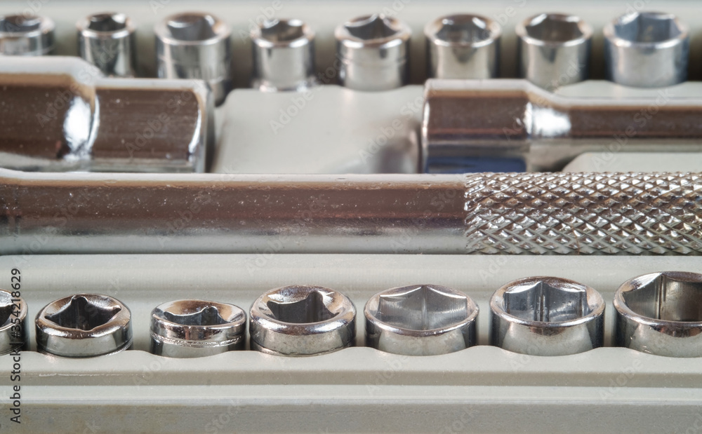 Socket spanner wrench and various wrench heads in the toolbox Socket spanner wrench and various wrench heads in the toolbox