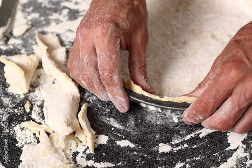 Press edges of dough sheet in baking tin. Making Shoofly Tart Series. photo