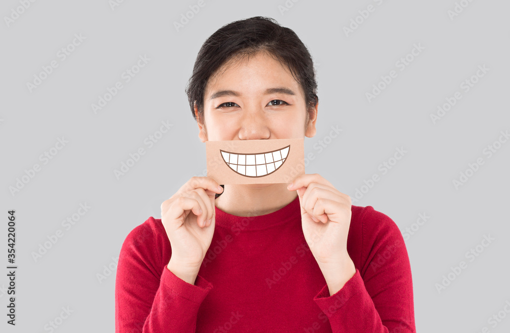 young asian woman holding happy emotion paper , advertising banner young asian woman holding happy emotion paper , advertising banner