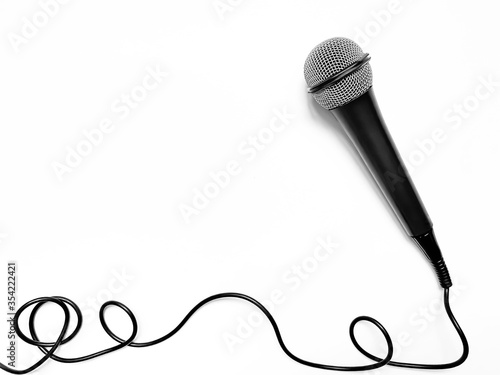 microphone for karaoke with a wire isolated on a white background.  top view, flat lay, copy space for your text