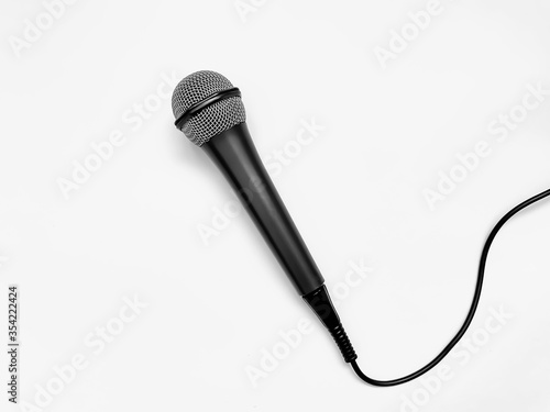 microphone for karaoke with a wire isolated on a white background.  top view, flat lay, copy space for your text