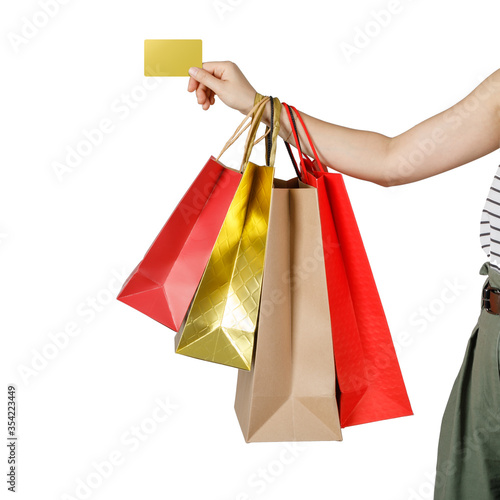 Shopping woman holding shopping bags and credit card, isolated on white studio background with copy space, E-commerce digital marketing lifestyle concept