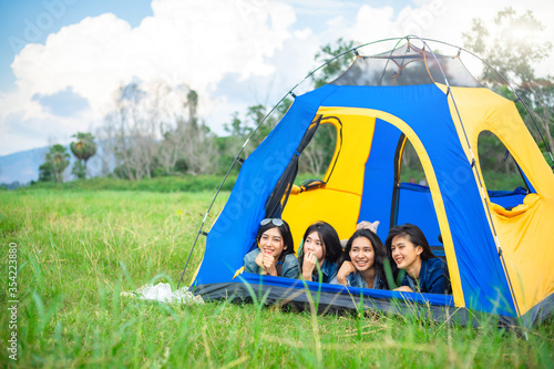 Happy group of friends having fun with camping.  Relaxation concept.