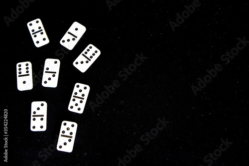 Fotografía Dominoes on a black background.